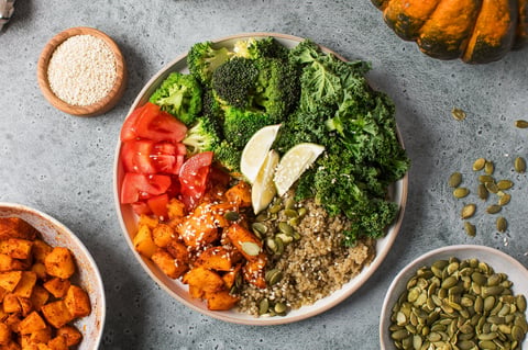 Healthy vegan Buddha bowl with quinoa, pumpkin and seasonal vegetables